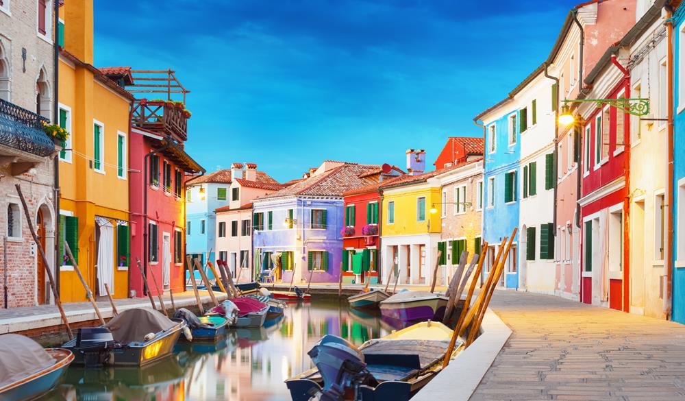 Colorful houses at night in Burano, Venice Italy.