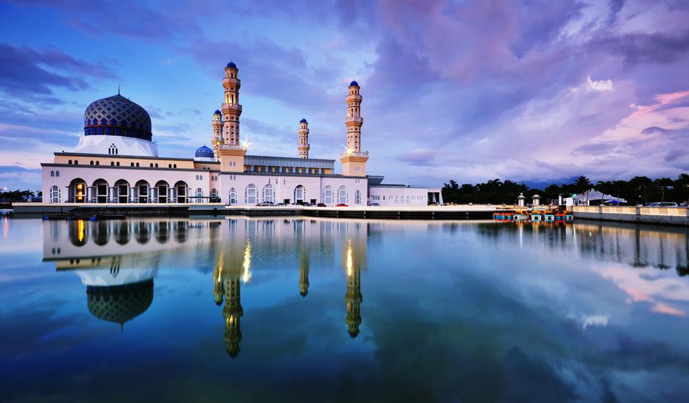 After sunset scenery and reflection of Kota Kinabalu mosque, famous landmark in Kota Kinabalu, Sabah Borneo, Malaysia.