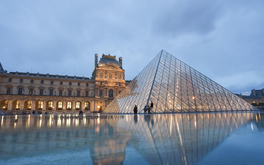 The Musee du Louvre or officially the Grand Louvre - in English, the Louvre Museum or Great Louvre, or more simply the Louvre - is a historic monument in Paris and the national museum of France. It is a central landmark of the city, located on the Right Bank of the Seine in the 1st arrondissement (neighbourhood). It's the most visited museum in the world and arguably the most famous one. Nearly 35,000 objects from the 6th millennium BC to the 19th century AD are exhibited over an area of 60,600 square metres (652,300 square feet).