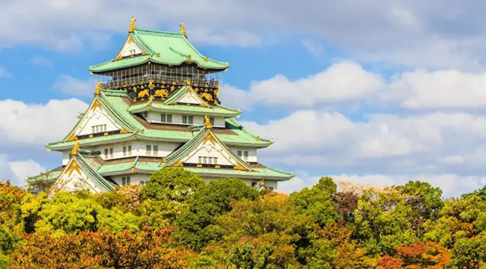 Osaka Castle with dramatic cloudy skies in Osaka.